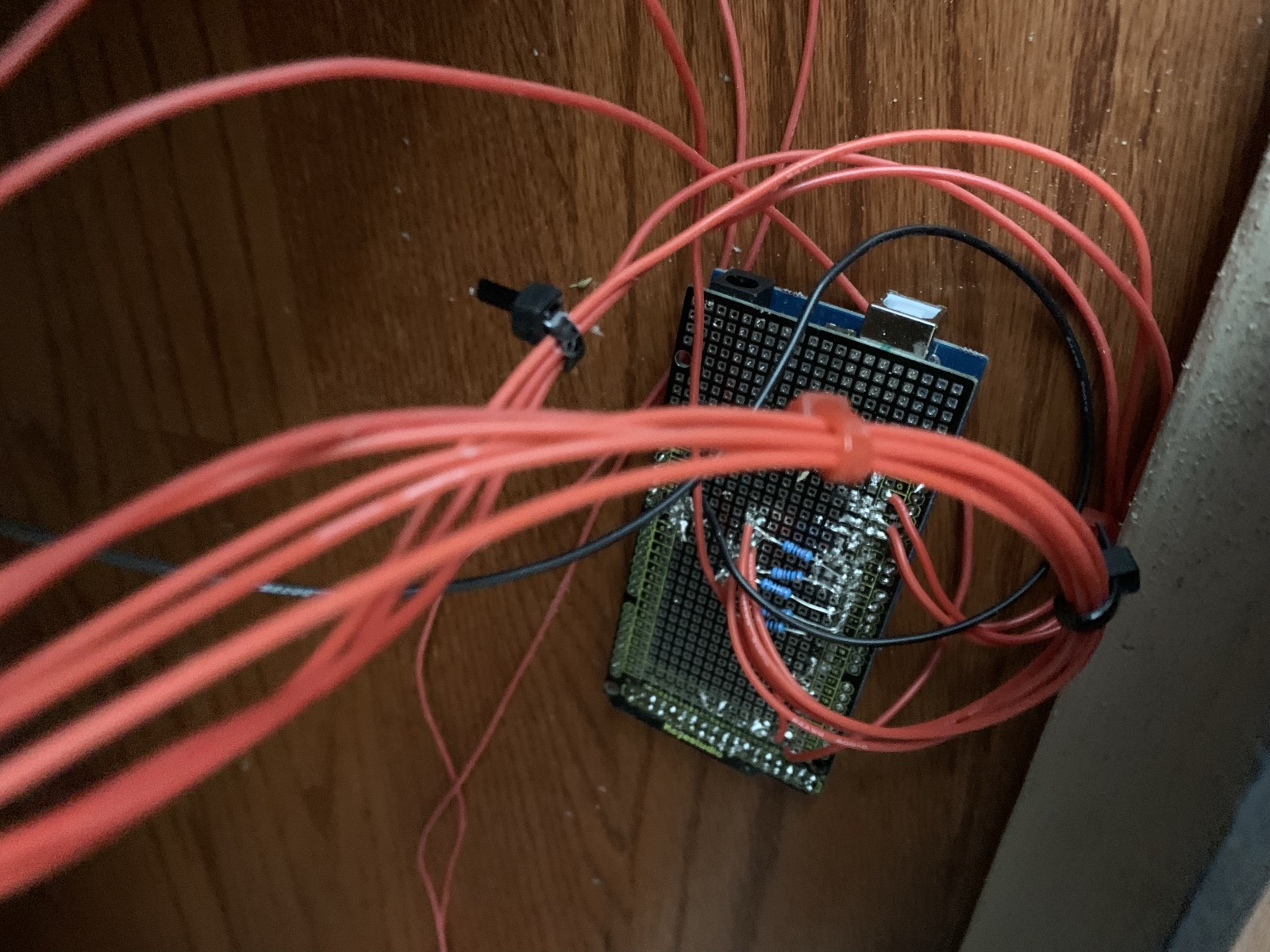 Arduino protoshield and wiring behind the panel