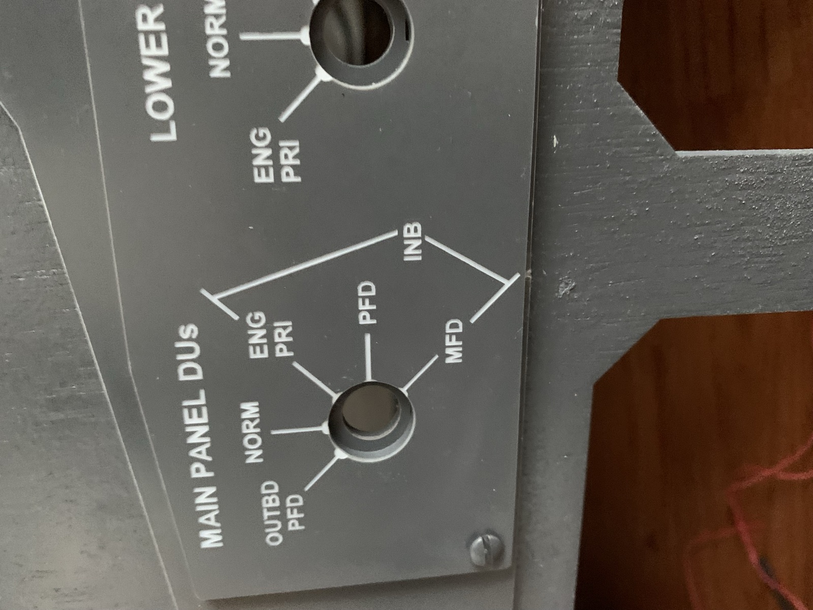 Close view of the cut display unit panel showing the MAIN PANEL DUs rotary and its labeled positions