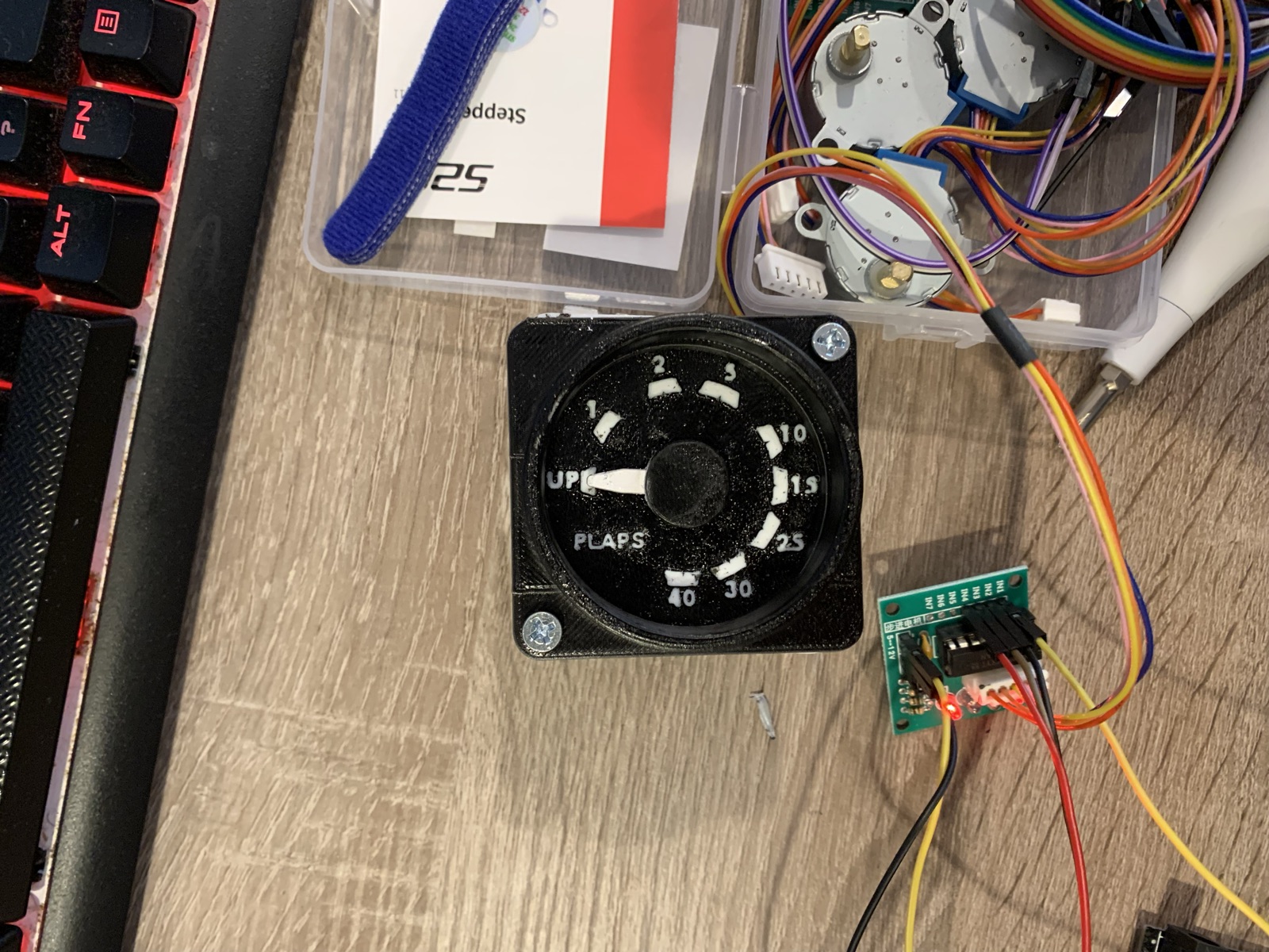 Flaps gauge with printed dial face, stepper motor and driver board during testing