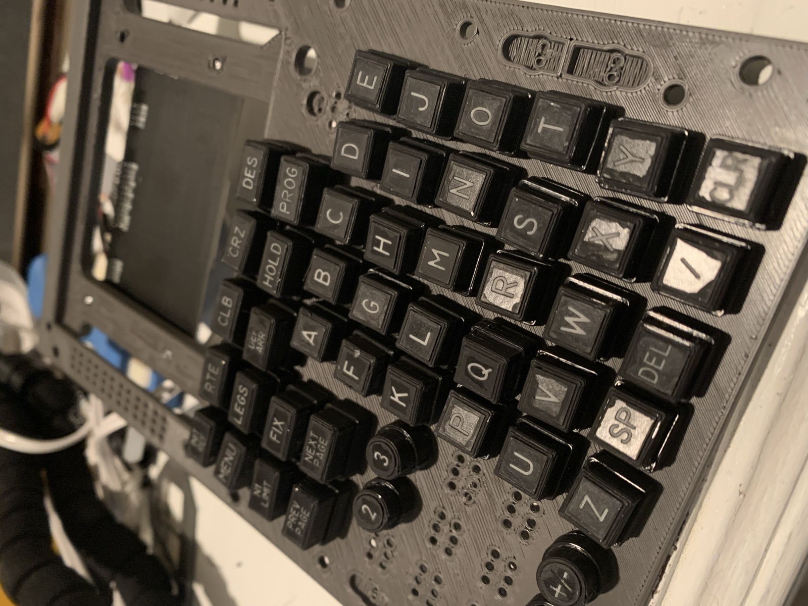Assembled FMC keypad in the cockpit frame with a screen opening above