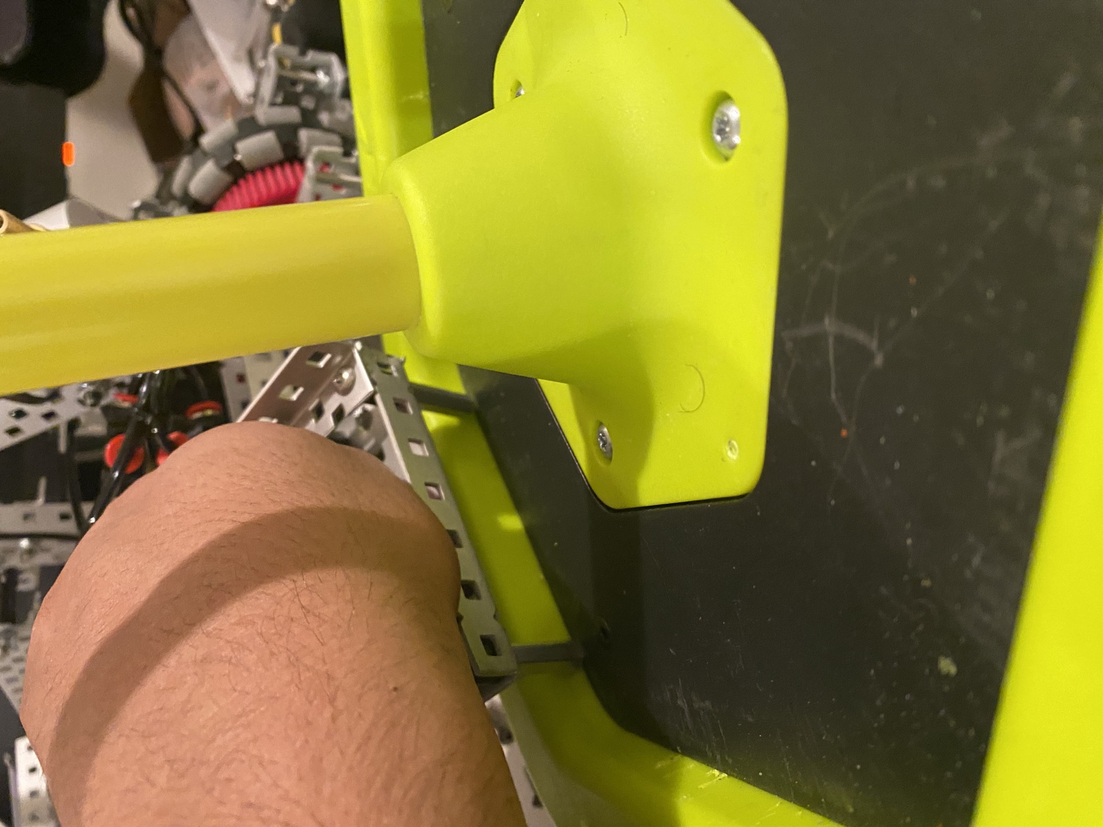 Close view of the mobile goal clamp plate holding a yellow goal post