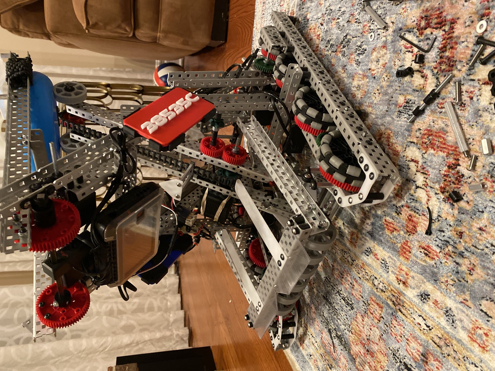 Top down view of the robot with the arm, gears, and V5 brain during a build session