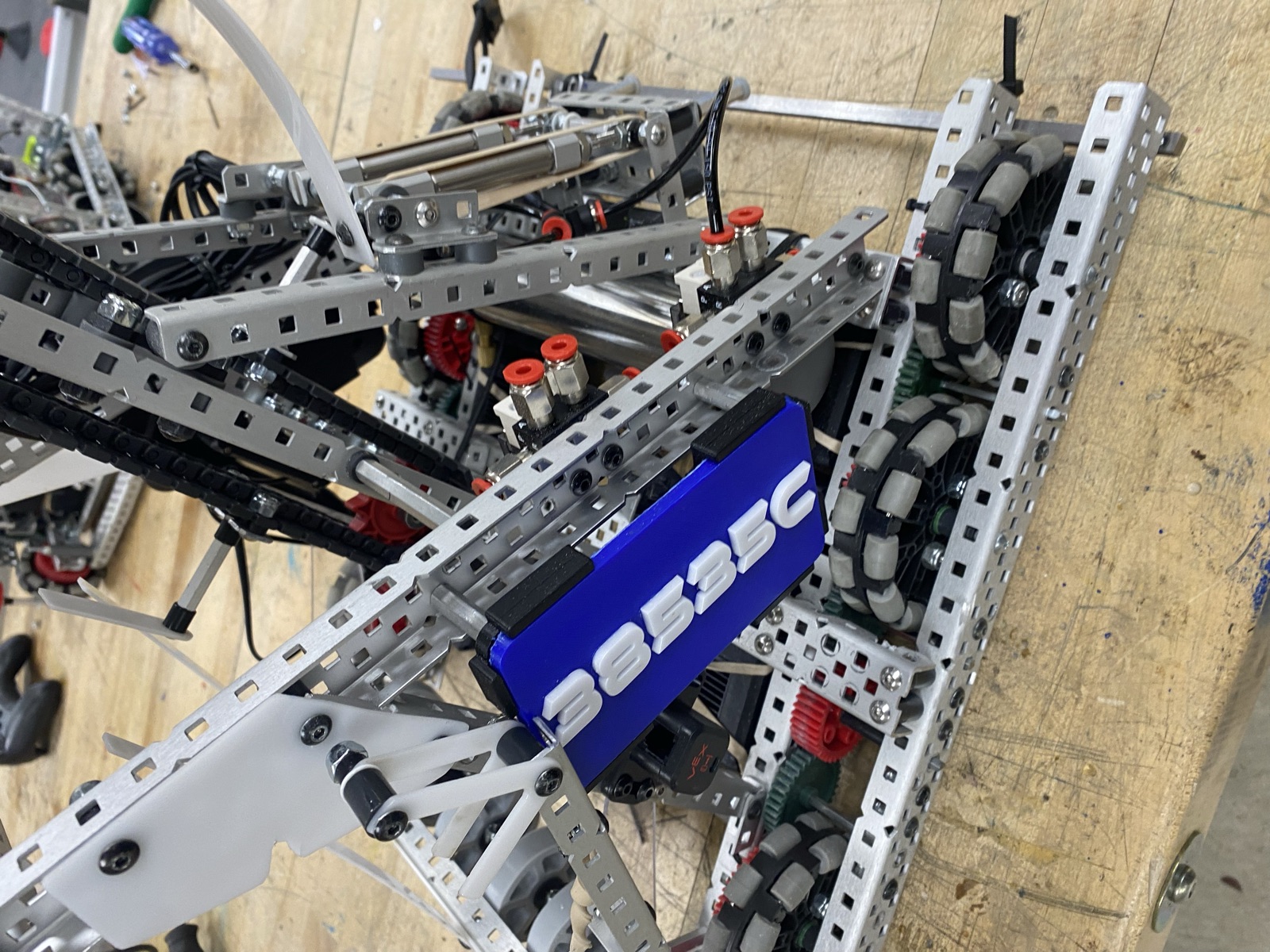 Mobile goal clamp mechanism built into the chassis with pneumatic cylinders