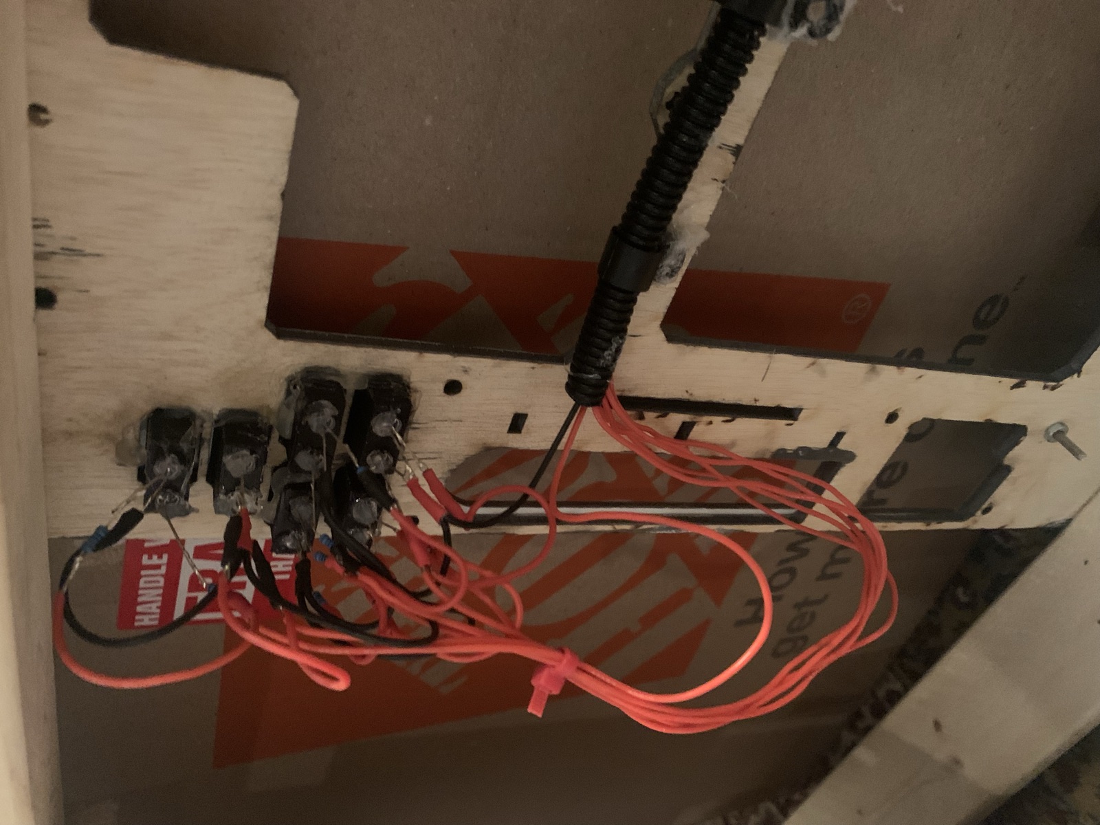 Back side of the panel showing the hand wired switches and red and black leads