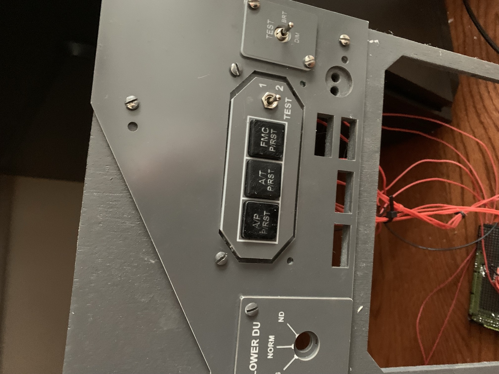 A/P, A/T, and FMC reset buttons with the two position test toggle and brightness switch