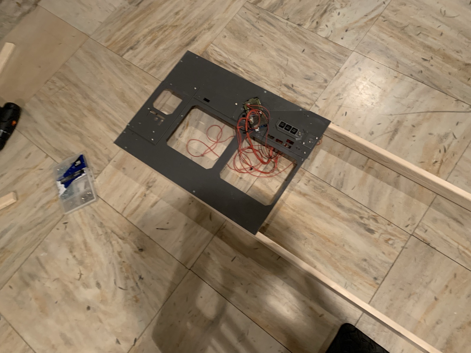 Main instrument panel on a wood floor showing the large screen openings