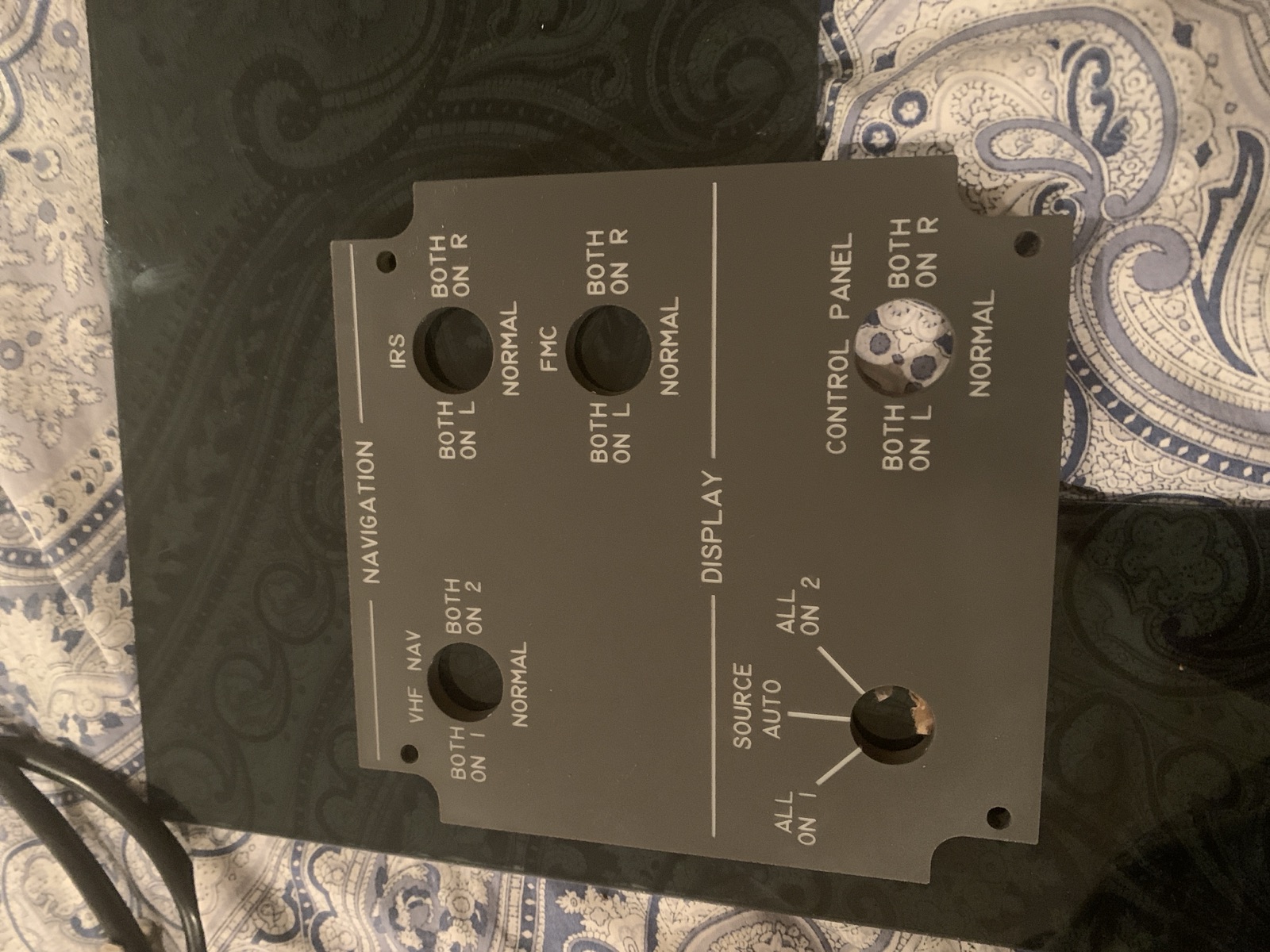 Finished navigation panel resting on a patterned surface