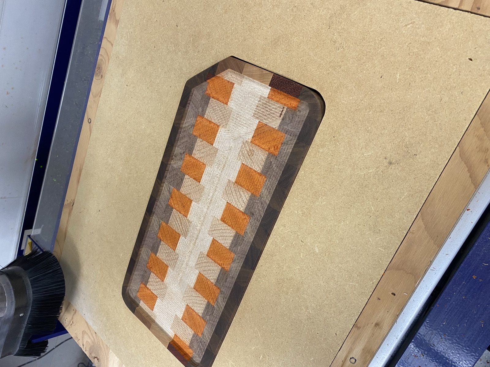 End grain cutting board with a colorful brick pattern